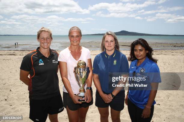 Sophie Devine, Rebecca Rolls, Dane Van Niekerk and Mithali Raj pose on the beach with the ICC Women’s Cricket World Cup during the ICC Women's...