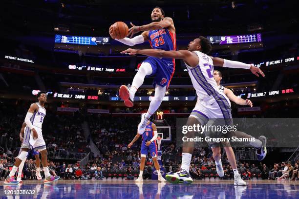 Derrick Rose of the Detroit Pistons drives to the basket past Buddy Hield of the Sacramento Kings during the second half at Little Caesars Arena on...