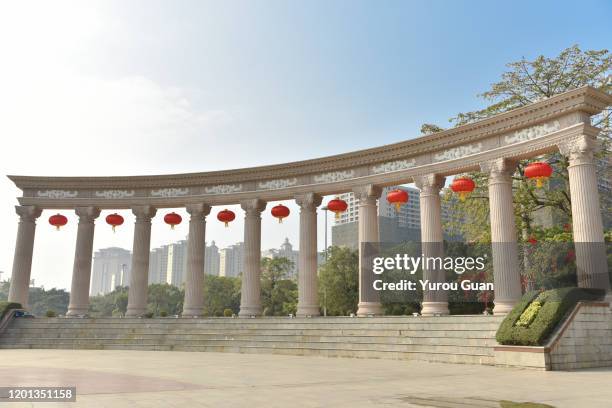 the traditional red lanterns hanging on roman column in guzhen town.. - guangdong province stock pictures, royalty-free photos & images