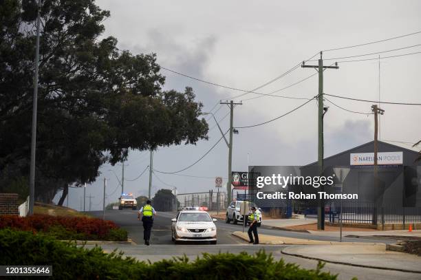 Police road closure in Queanbyean NSW as fire crews work to contain a fire near at the industrial suburb of Beard and residential suburb of Oaks...