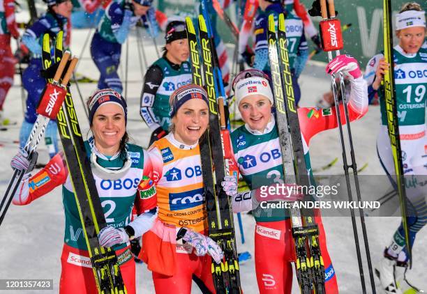 Winner Therese Johaug , second placed Heidi Weng and third placed Ingvild Flugstad Ostberg, all from Norway, pose after the Women's 10kms Pursuit...