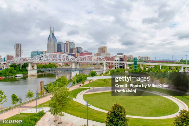 nashville with cumberland park and the cumberland river. - nashville downtown district stock pictures, royalty-free photos & images