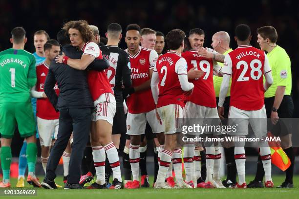 Mikel Arteta the manager / head coach of Arsenal and David Luiz at full time of the Premier League match between Arsenal FC and Newcastle United at...