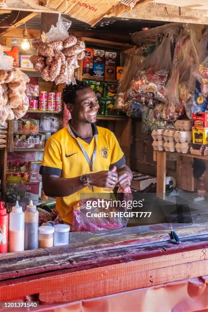 supermarket kiosk and african attendant smiling in alexandra township - market vendor stock pictures, royalty-free photos & images