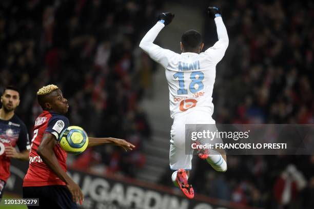 Lille's Nigerian forward Victor Osimhen vies with Marseille' French defender Jordan Amavi during the French L1 football match between Lille LOSC and...