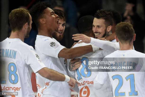 Marseille's Argentine forward Ismael Benedetto celebrates with teammates after scoring a goal during the French L1 football match between Lille LOSC...