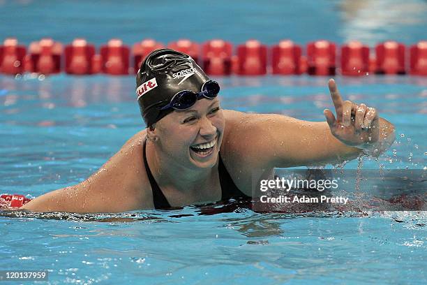 Elizabeth Beisel of the United States celebrates winning the gold medal in the Women's 400m Individual Medley Final during Day Sixteen of the 14th...