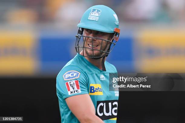 Chris Lynn of the Heat walks off the field after being bowled out by Stephen O'Keefe of the Sixers during the Big Bash League match between the...