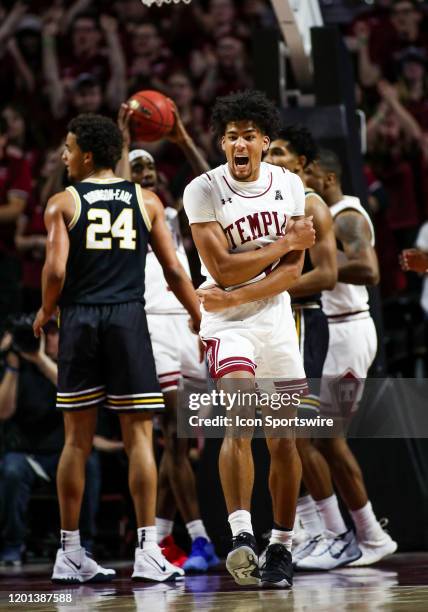 Temple Owls forward Jake Forrester yells in celebration after scoring a layup off a rebound during the game between the Villanova University Wildcats...