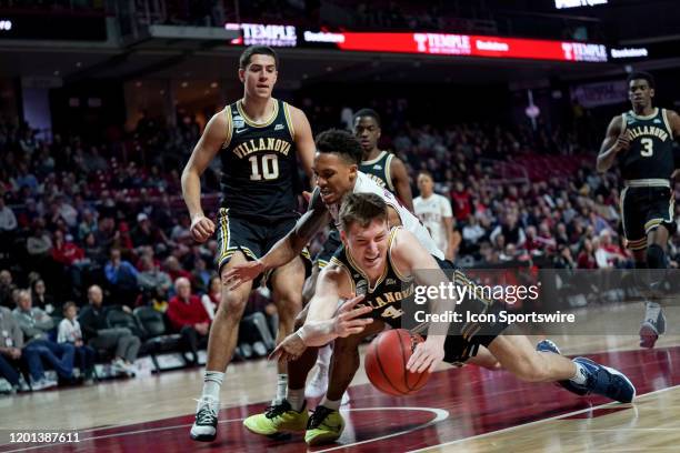 Villanova Wildcat guard Chris Arcidiacono dives to keep the ball in play and in Villanova possession during the last few moments of the second half...