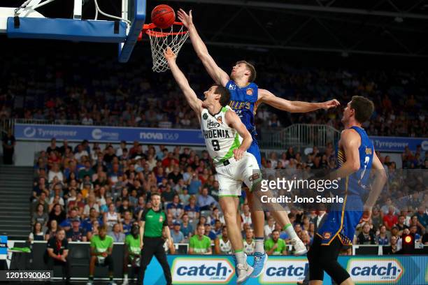 Will Magnay of the Bullets blocks Ben Madgen of the Phoenix during the round 17 NBL match between the Brisbane Bullets and the South East Melbourne...