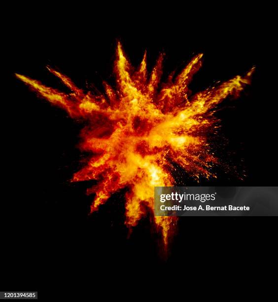 explosion by an impact of a cloud of particles of powder and smoke of color orange and yellow on a black background. - colourful studio shots stock-fotos und bilder