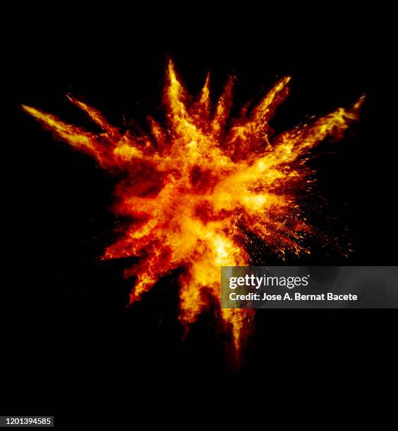 explosion by an impact of a cloud of particles of powder and smoke of color orange and yellow on a black background. - shooting a weapon bildbanksfoton och bilder