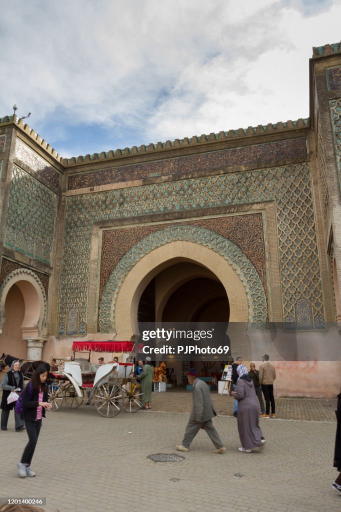 People walking in front of the biggest gate of Africa in Lahdim Square in Meknes - Morocco