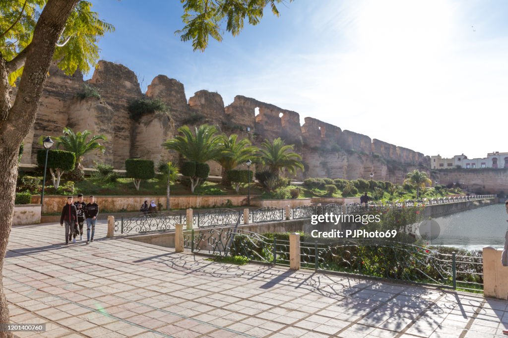 People walking near of Bassin Souani and Royal Stables in Meknes - Morocco
