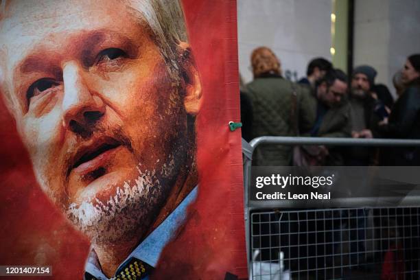 Sign placed by supporters of Wikileaks founder Julian Assange is seen as people wait in line at The City of Westminster Magistrates Court on January...