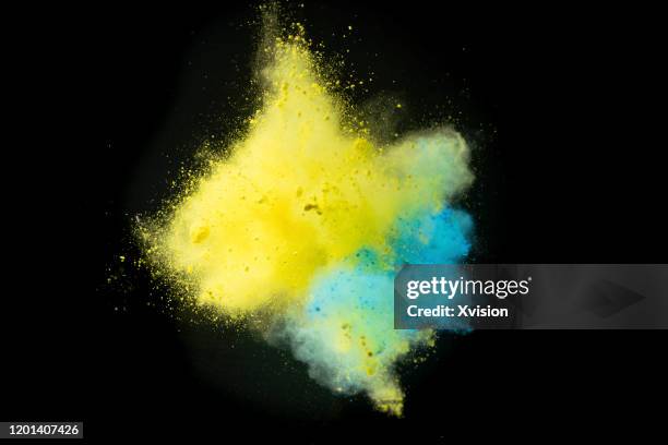 explode color powder captured with high speed sync. - black powder stock-fotos und bilder