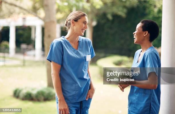 teamwork makes a retirement home work - two people talking outside stock pictures, royalty-free photos & images