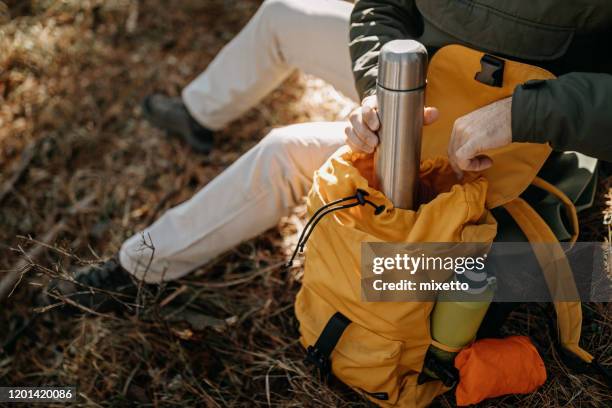 it's important to stay hydrated during a hiking - backpacks stock pictures, royalty-free photos & images