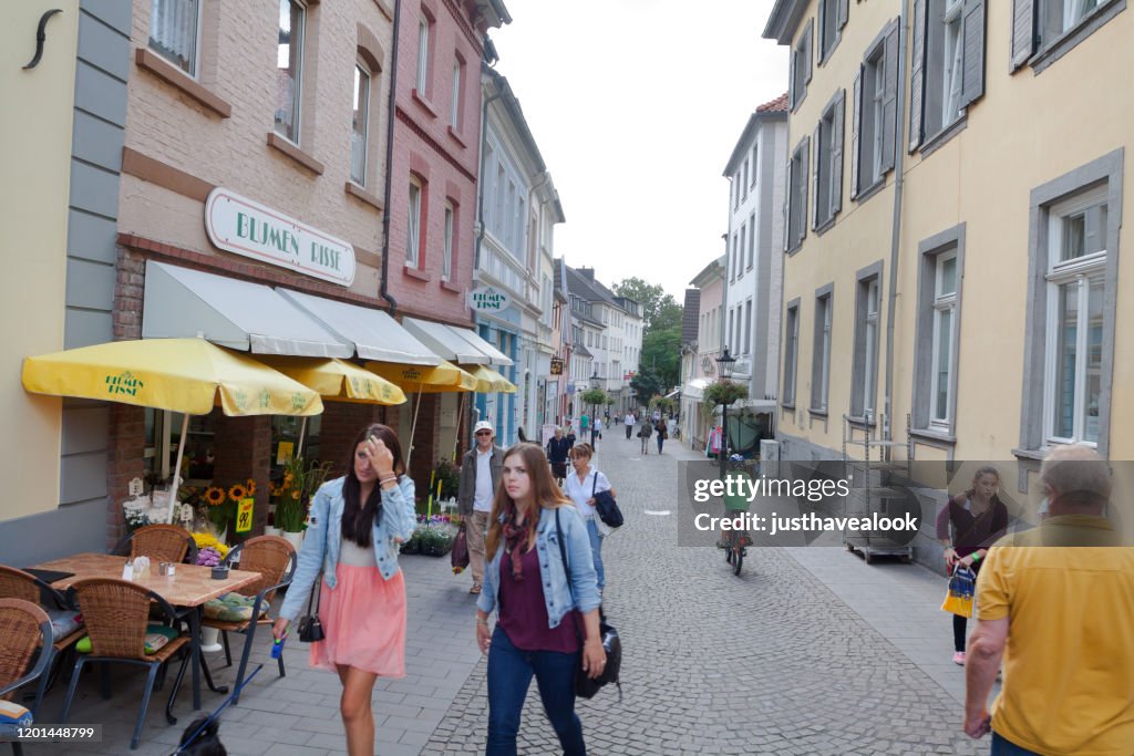 People in street Brunostrasse in Ratingen in summertime
