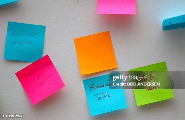 Post-it notes with suggestions stick at the 70th Berlinale film festival message board as the film festival tickets to go on sale at the Potsdamer...