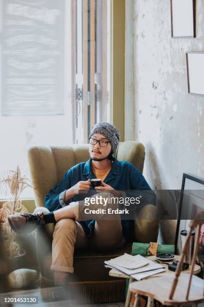 critical thinking: hipster men thinking his work while drinking hot espresso at the coffee shop - hipster coffee shop candid stock pictures, royalty-free photos & images