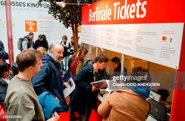 People queue to buy tickets for the 70th Berlinale film festival as the sale starts at the Potsdamer Arkaden mall in Berlin on February 17, 2020. -...