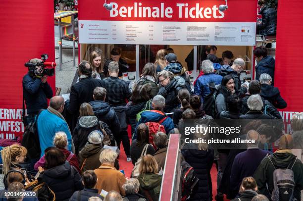February 2020, Berlin: Film lovers are standing at one of the ticket booths in the Potsdamer Platz Arkaden to buy tickets for the International Film...