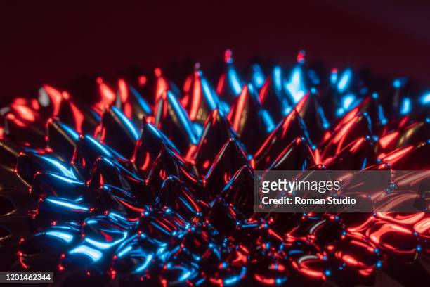 sculpture of ferrofluid induced by a neodymium magnet - ferro stockfoto's en -beelden