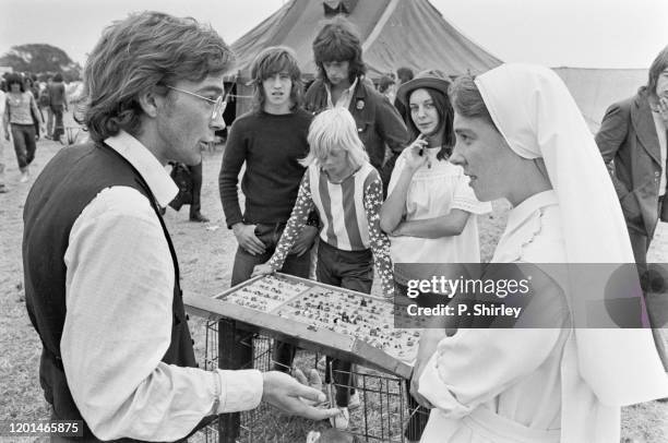 Reverend Bill Coupe and Sister Sheela Davies offering religious guidance to rock fans at the 1972 Reading Festival in Reading, Berkshire, 12th August...