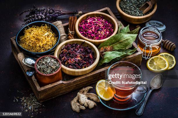 various dried tea leaves and flowers shot from above - naturopath stock pictures, royalty-free photos & images