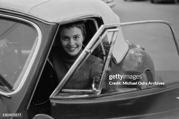 American actress Jean Seberg at the wheel of a sports car in her home town of Marshalltown, Iowa, March 1957. She has just returned to the USA after...