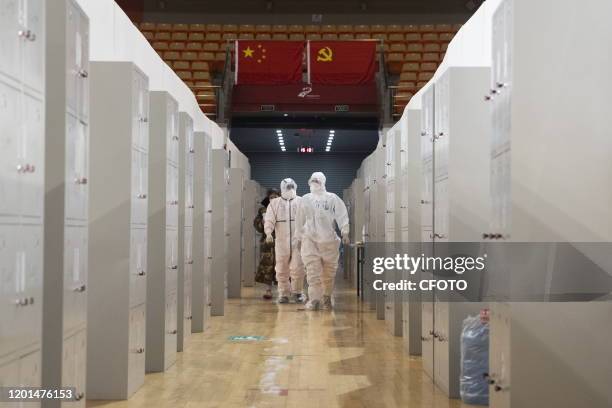 Doctors in Wuhan fangcang hospital, Wuhan City, Hubei Province, China, February 14, 2020.- PHOTOGRAPH BY Costfoto / Future Publishing