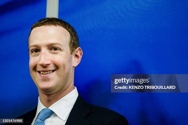 Founder and CEO of US online social media and social networking service Facebook Mark Zuckerberg reacts upon his arrival for a meeting with European...