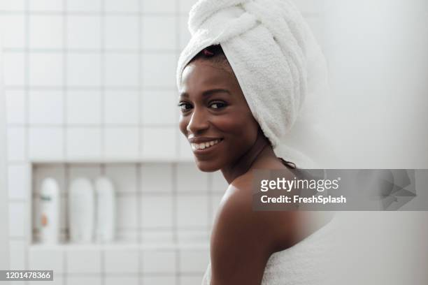 portrait of a woman in bathroom - woman shower bath imagens e fotografias de stock