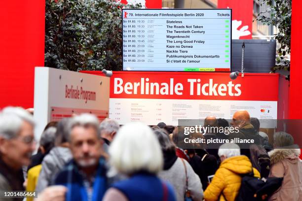February 2020, Berlin: People wait in front of a ticket counter in the Berliner Arkaden at Potsdamer Platz to buy tickets for the Berlinale. Advance...