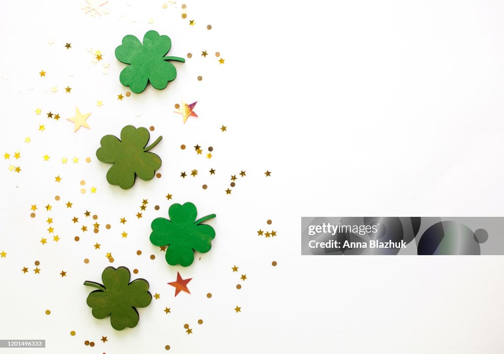 Green Clovers or Shamrocks and confetti white Background for St. Patrick's Day Holiday
