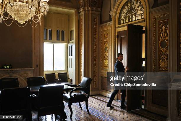 White House Deputy Press Secretary Hogan Gidley steps into an office being used by President Donald Trump's defense team at the U.S. Capitol during...
