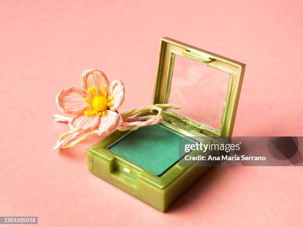 a green eyeshadow and a flower - green eyeshadow stock pictures, royalty-free photos & images