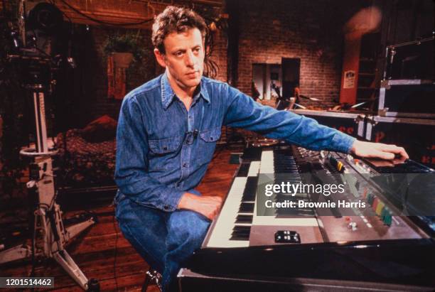 Portrait of American Minimalist composer and musician Philip Glass as he sits at a keyboard, New York, New York, 1978.