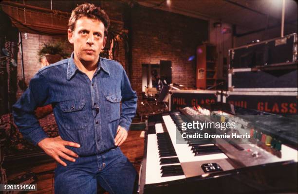 Portrait of American Minimalist composer and musician Philip Glass as he sits at a keyboard, New York, New York, 1978.