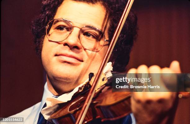 Israeli-American Classical musician, conductor, and educator Itzhak Perlman plays violin as he performs onstage, New York, New York, 1978.