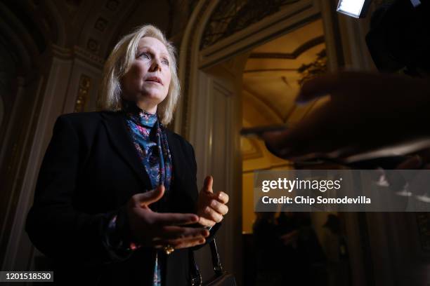 Sen. Kirsten Gillibrand talks to journalists in the Senate Reception Room at the U.S. Capitol during the third day of Trump's impeachment trial at...