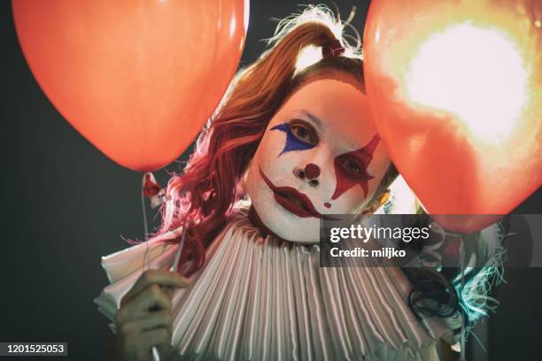 young woman with joker make-up - evil clown stock pictures, royalty-free photos & images