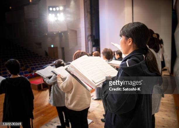 rehearsal of women's chorus concert - choir stage stock pictures, royalty-free photos & images