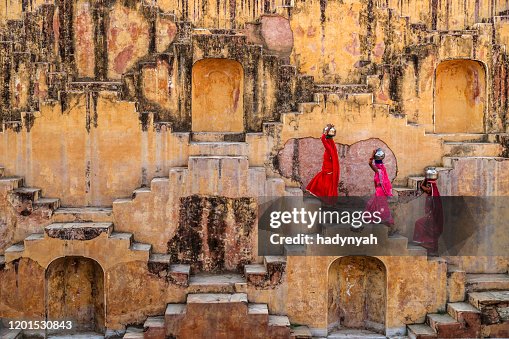 Indian women carrying water from stepwell near Jaipur Indian women carrying water from stepwell near Jaipur