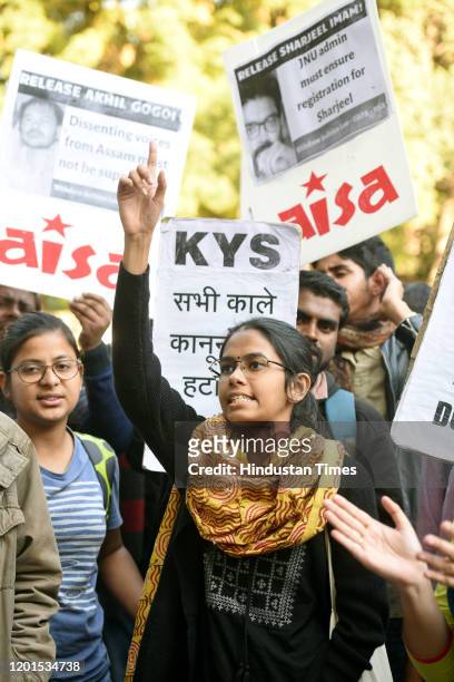 Jawaharlal Nehru University Students Union president Aishe Ghosh and others raise slogans and hold placards during a protest against Citizenship...