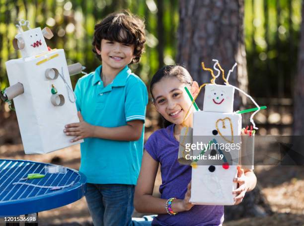 hispanic children, siblings, doing arts and crafts - preteen girl models stock pictures, royalty-free photos & images