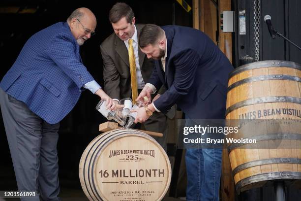 Jim Beam Master Distiller Fred Noe , Kentucky Gov. Andy Beshear and Freddie Now, Beam Distiller, fill the distillery's 16 millionth barrel of bourbon...