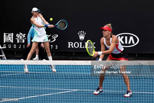 Monique Adamczak of Australia and Katarina Srebotnik of Slovenia play in their Women's Doubles first round match against Georgina Garcia Perez and...